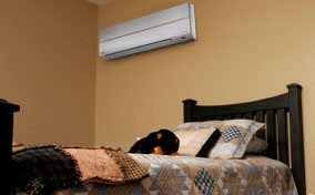 ductless mini-split AC unit installed inside a bedroom