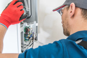 Technician providing heating repair