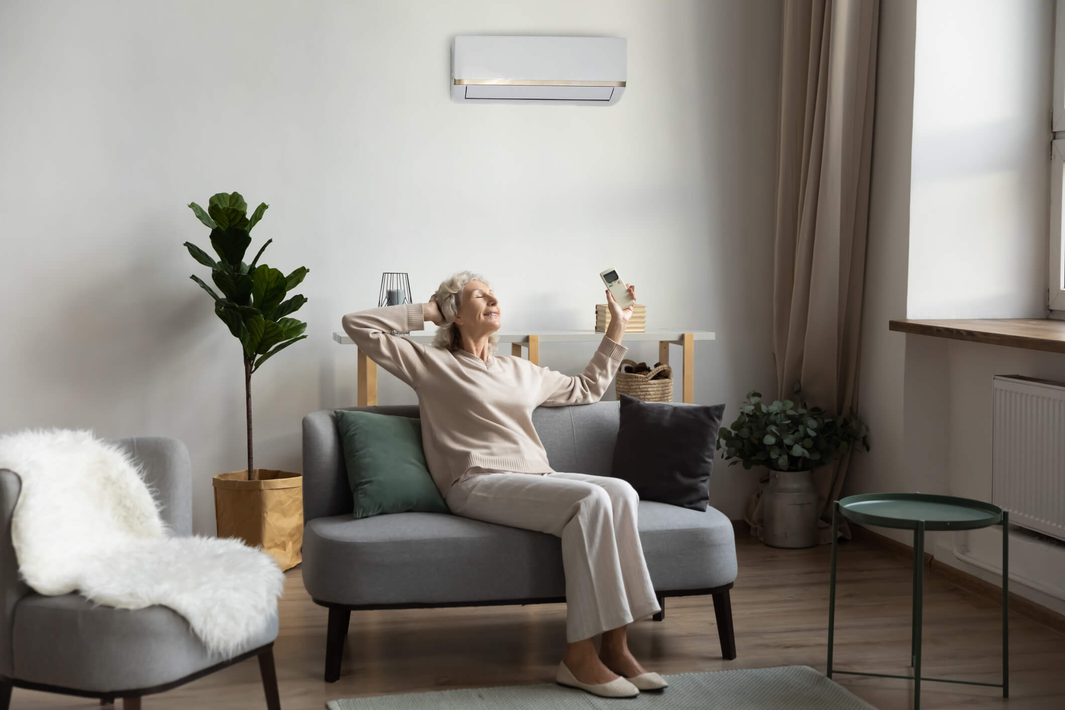 Woman operating her home's heating system