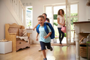 Children running inside to cooled home